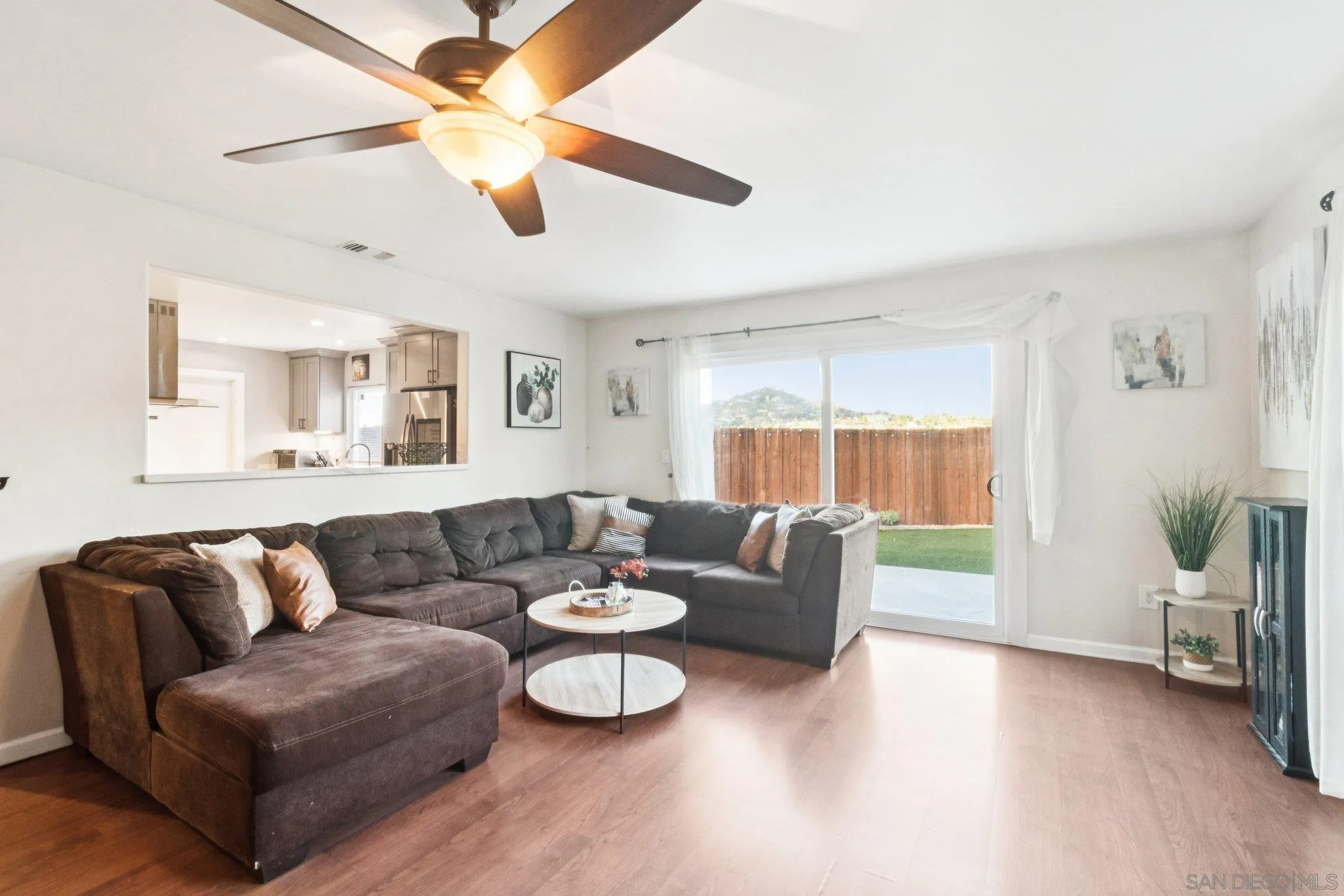 3365 South Bonita Street Spring Valley, CA 91977 - Photo 11 of 32 a living room with furniture and a large window