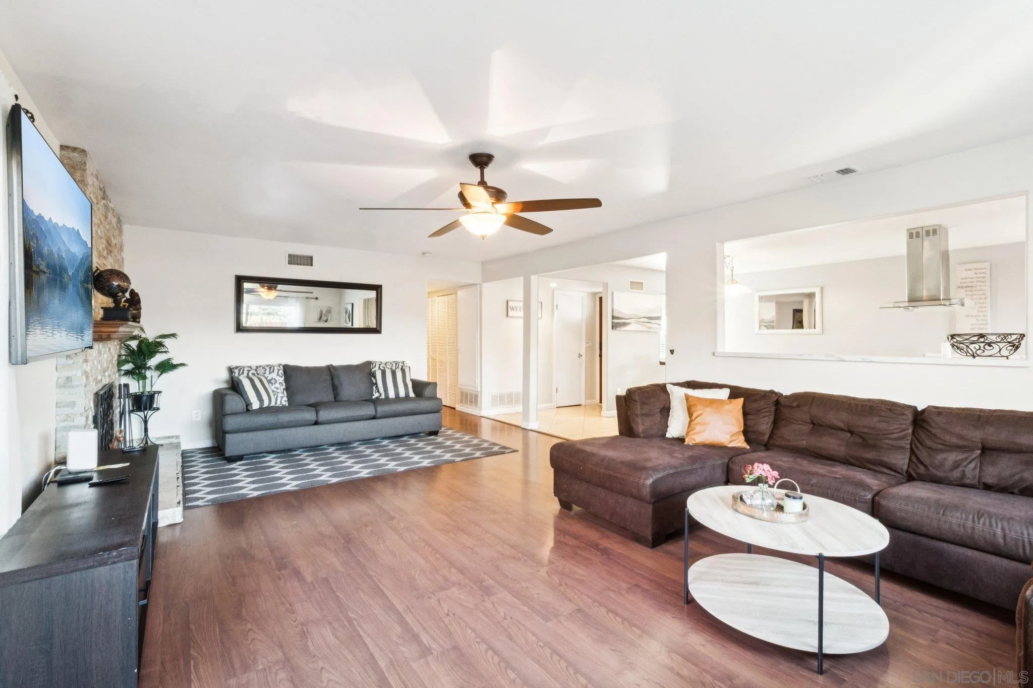 3365 South Bonita Street Spring Valley, CA 91977 - Photo 12 of 32 a living room with furniture and a wooden floor