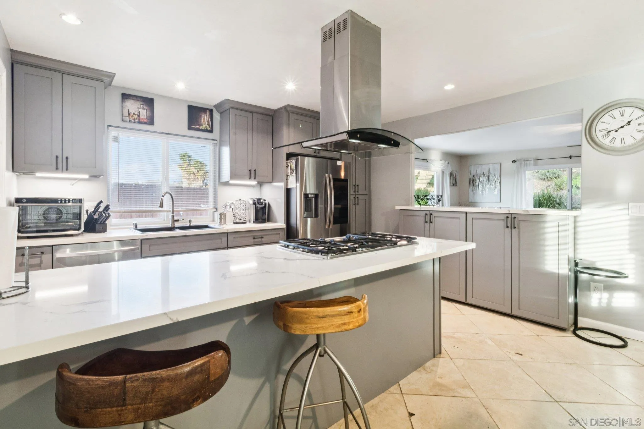 3365 South Bonita Street Spring Valley, CA 91977 - Photo 14 of 32 a kitchen with stainless steel appliances granite countertop a stove and a sink