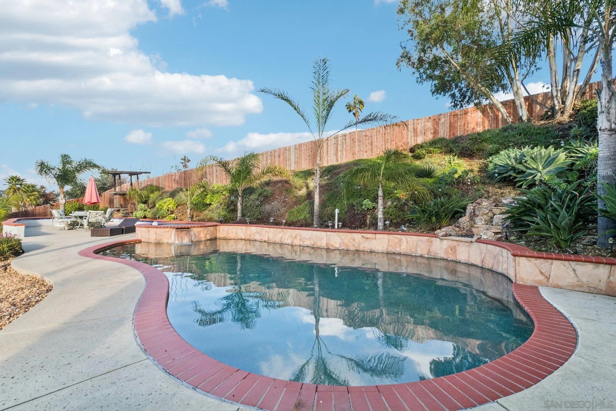 3365 South Bonita Street Spring Valley, CA 91977 - Photo 2 of 32 a view of a swimming pool with a patio