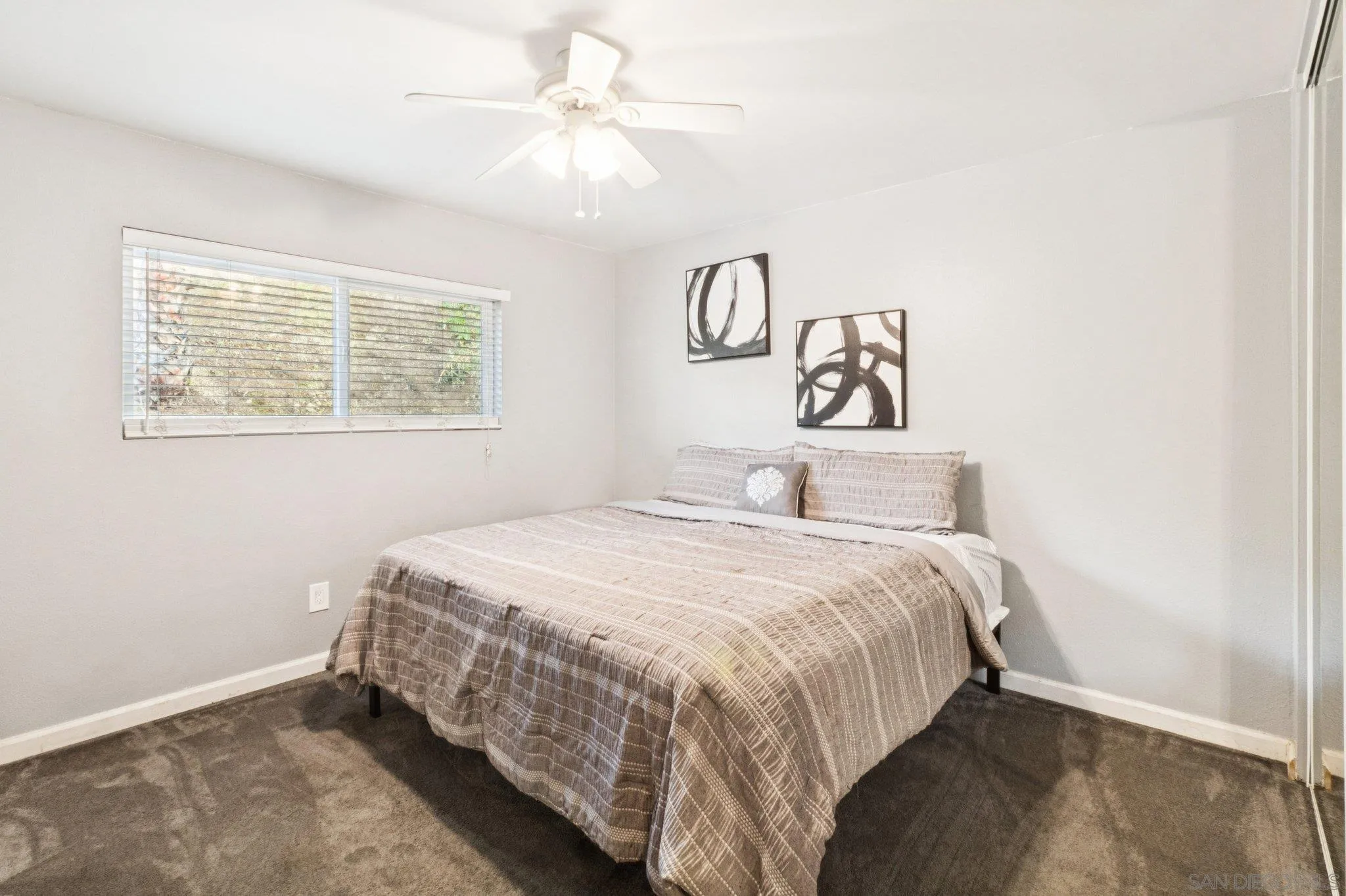 3365 South Bonita Street Spring Valley, CA 91977 - Photo 26 of 32 a bedroom with a bed and a window