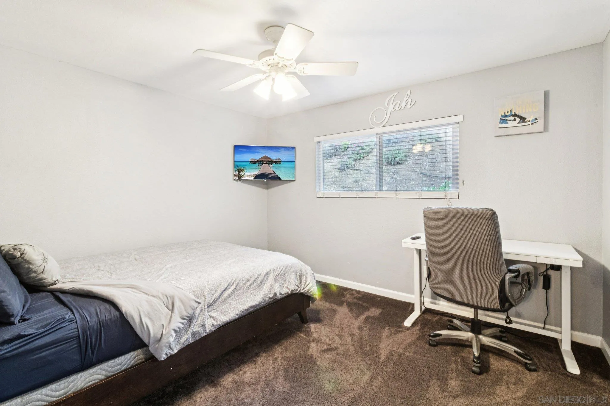 3365 South Bonita Street Spring Valley, CA 91977 - Photo 29 of 32 a bedroom with a bed and a chair