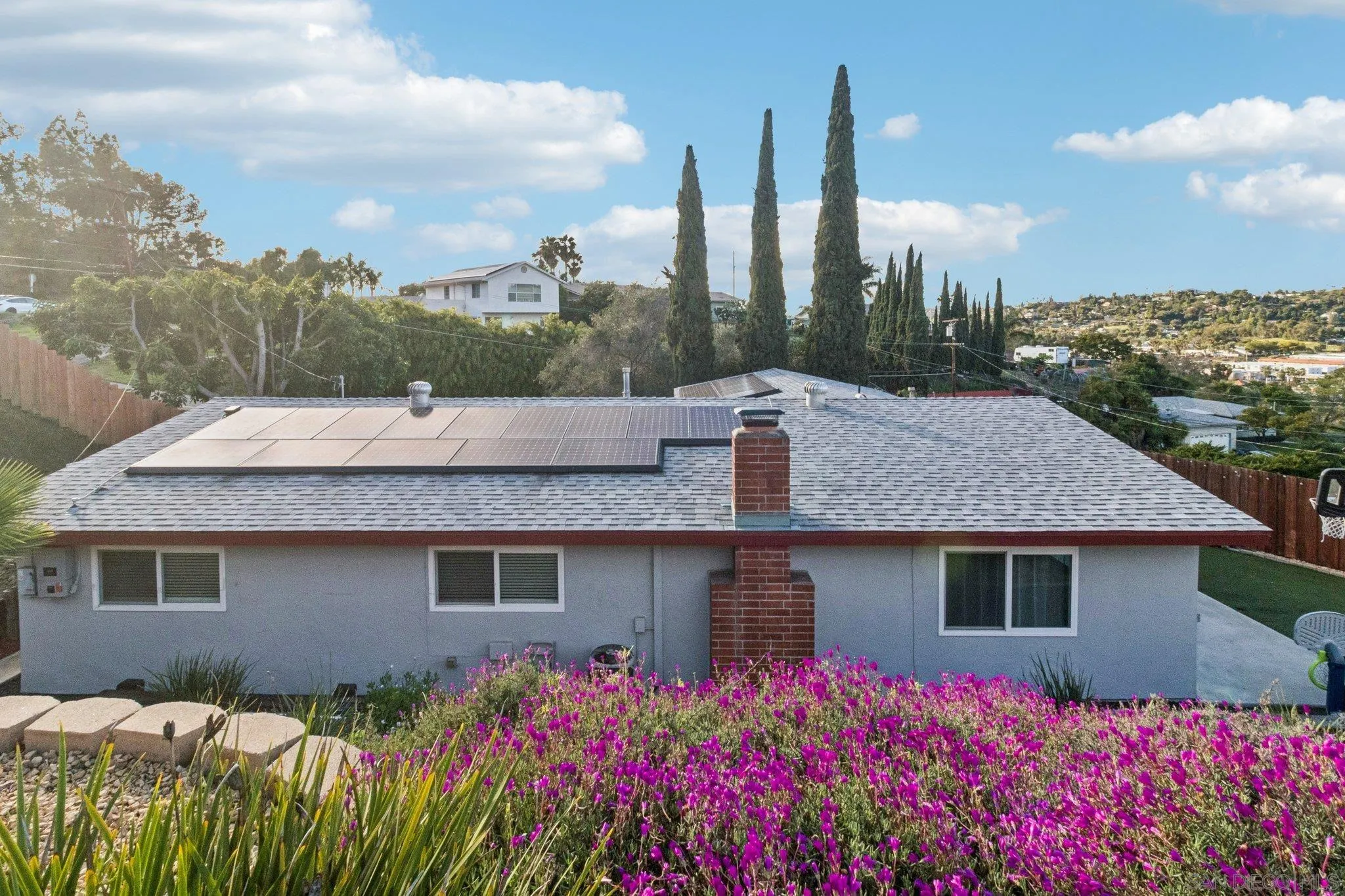 3365 South Bonita Street Spring Valley, CA 91977 - Photo 6 of 32 a front view of a house with a yard