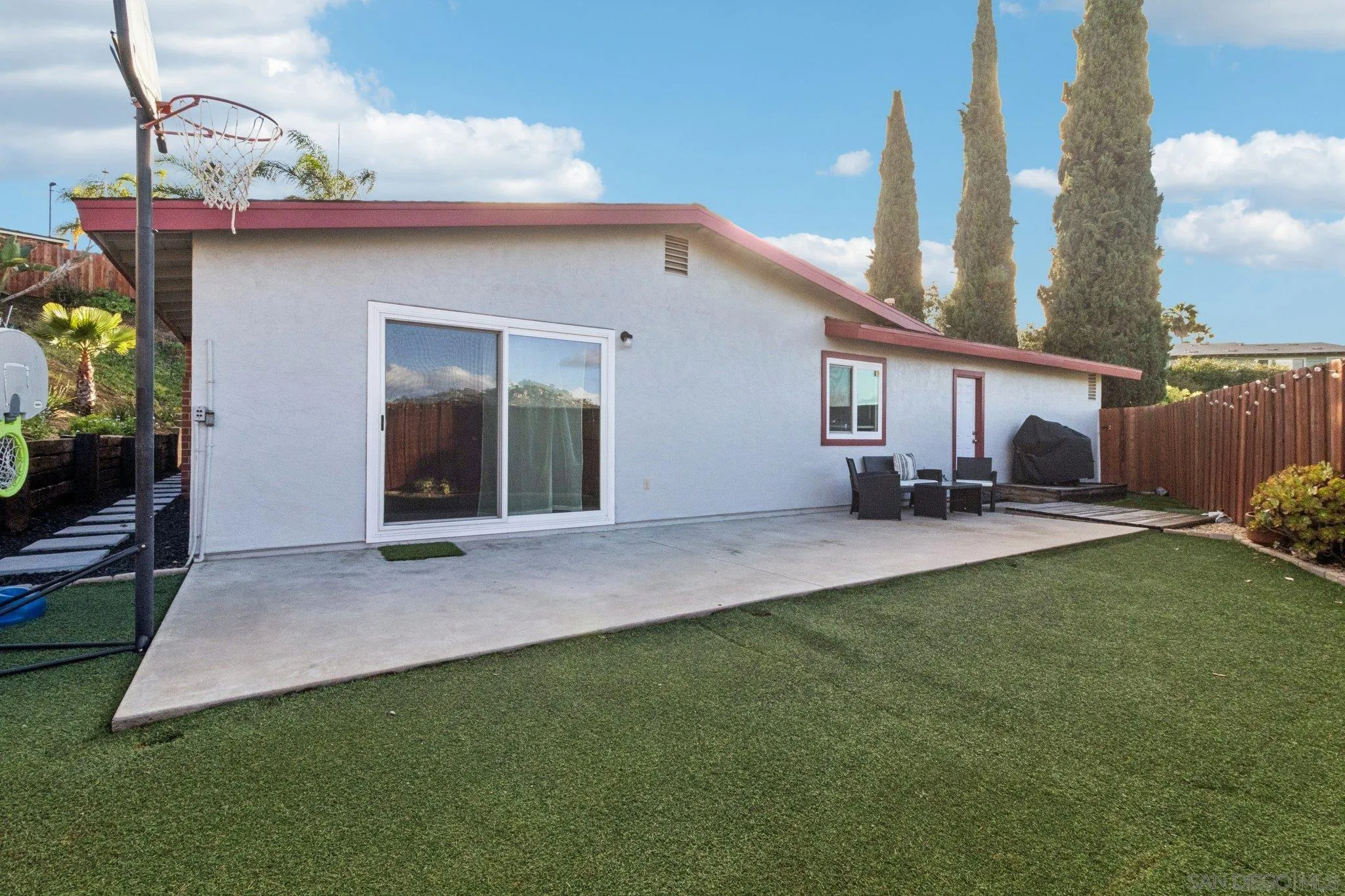 3365 South Bonita Street Spring Valley, CA 91977 - Photo 7 of 32 a view of a house with backyard and porch