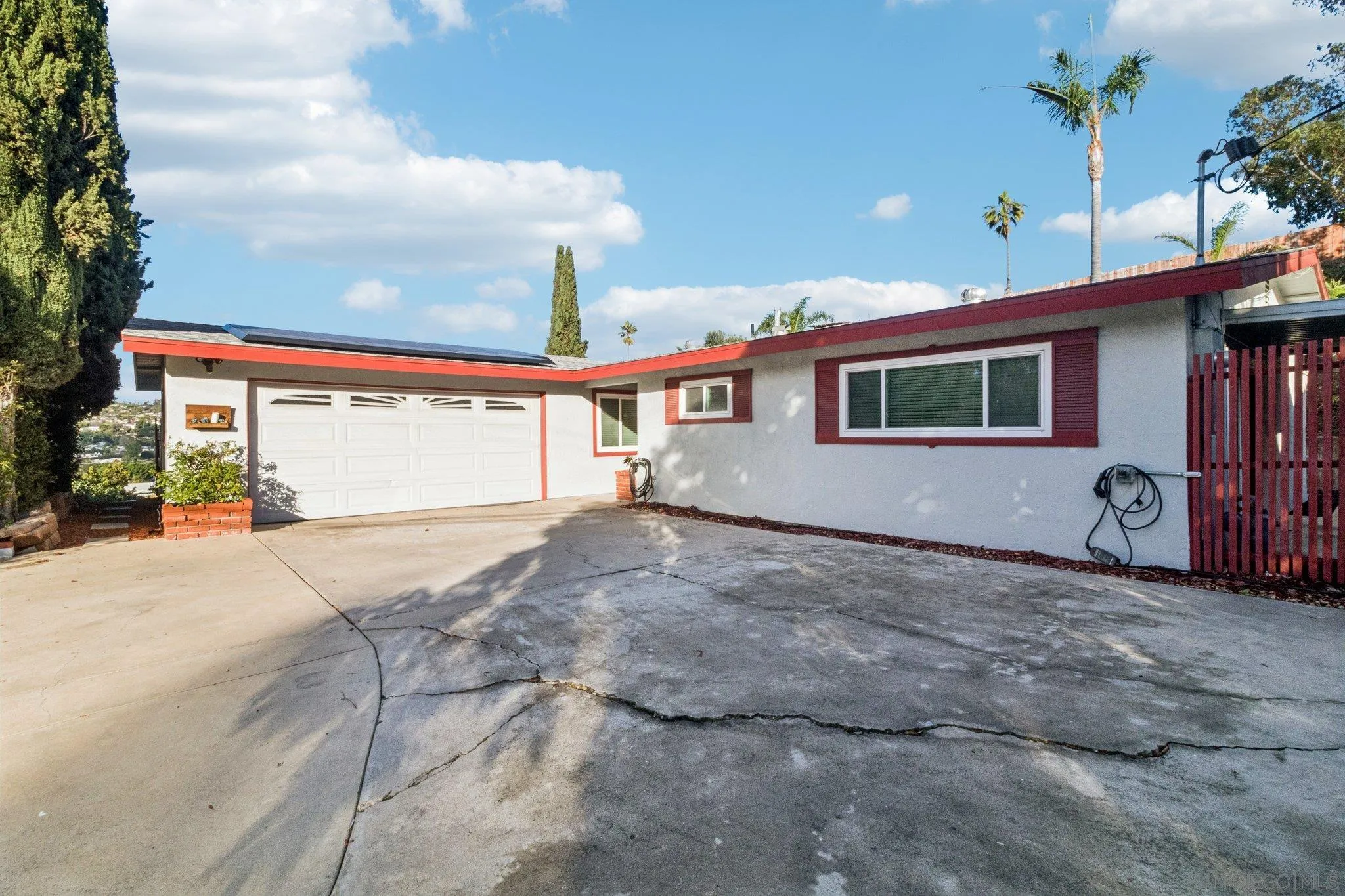 3365 South Bonita Street Spring Valley, CA 91977 - Photo 8 of 32 a view of a house with a patio and a yard