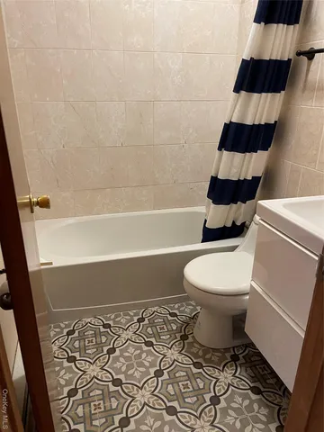 a bathroom with a toilet a sink and a bathtub