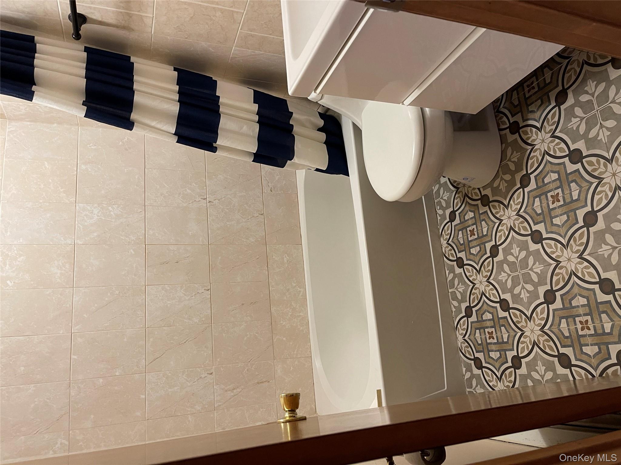 257 Lake Road Salisbury Mills, NY 12577 - Photo 12 of 30 a bathroom with a toilet a sink and a bathtub