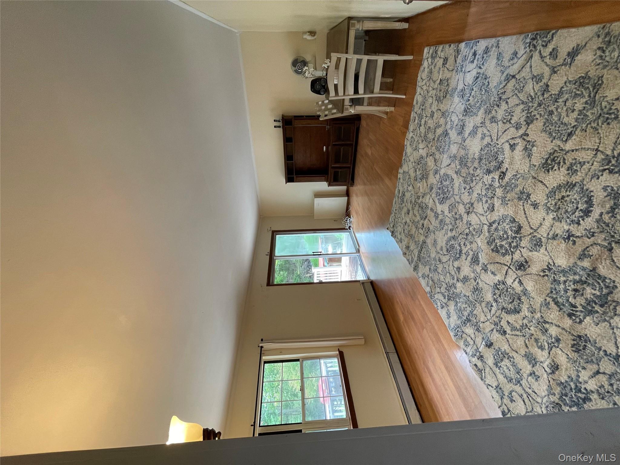 257 Lake Road Salisbury Mills, NY 12577 - Photo 13 of 30 a view of a livingroom with furniture and an empty room