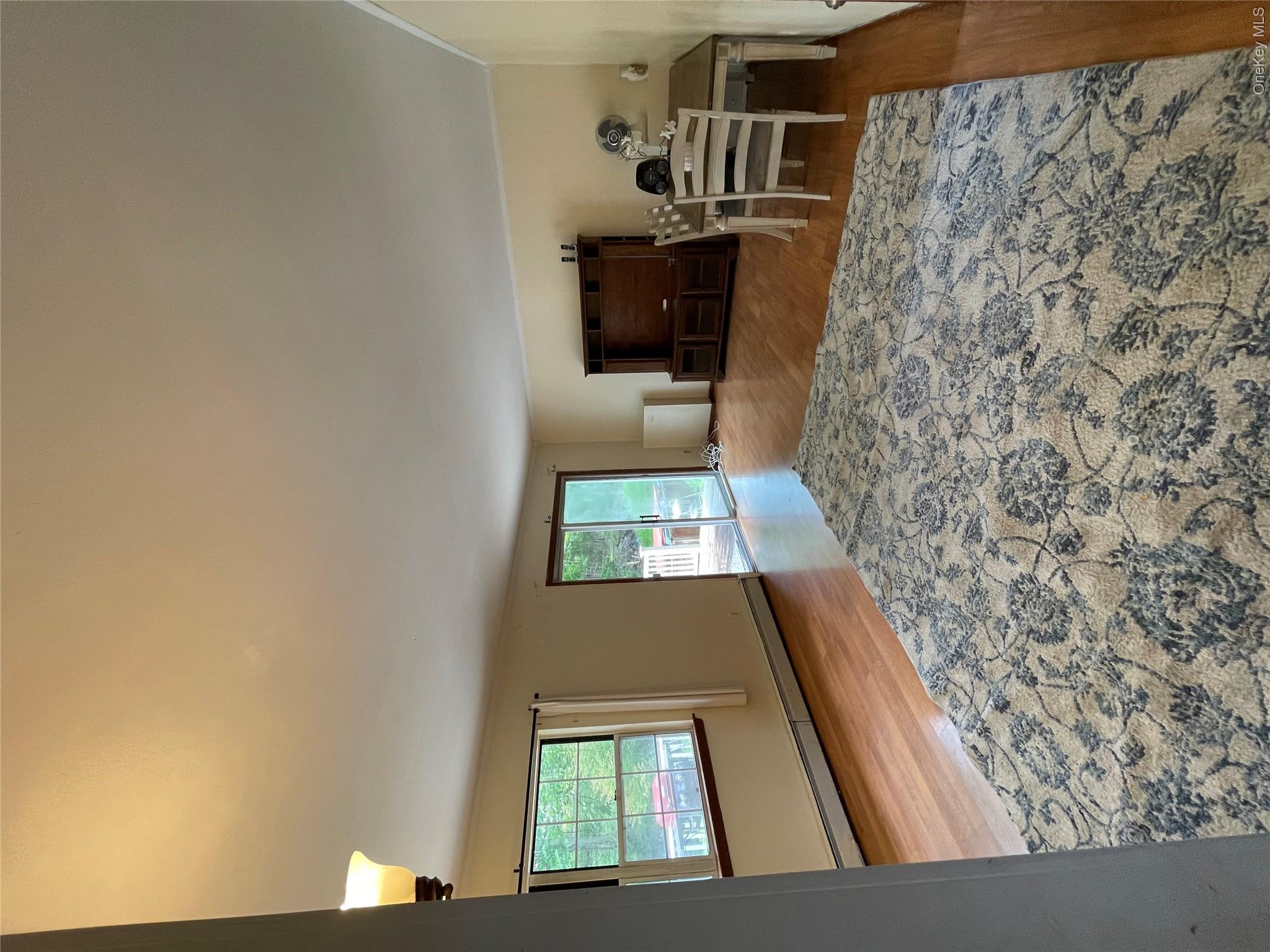 257 Lake Road Salisbury Mills, NY 12577 - Photo 13 of 30 Living room with baseboard heating and wood finished floors