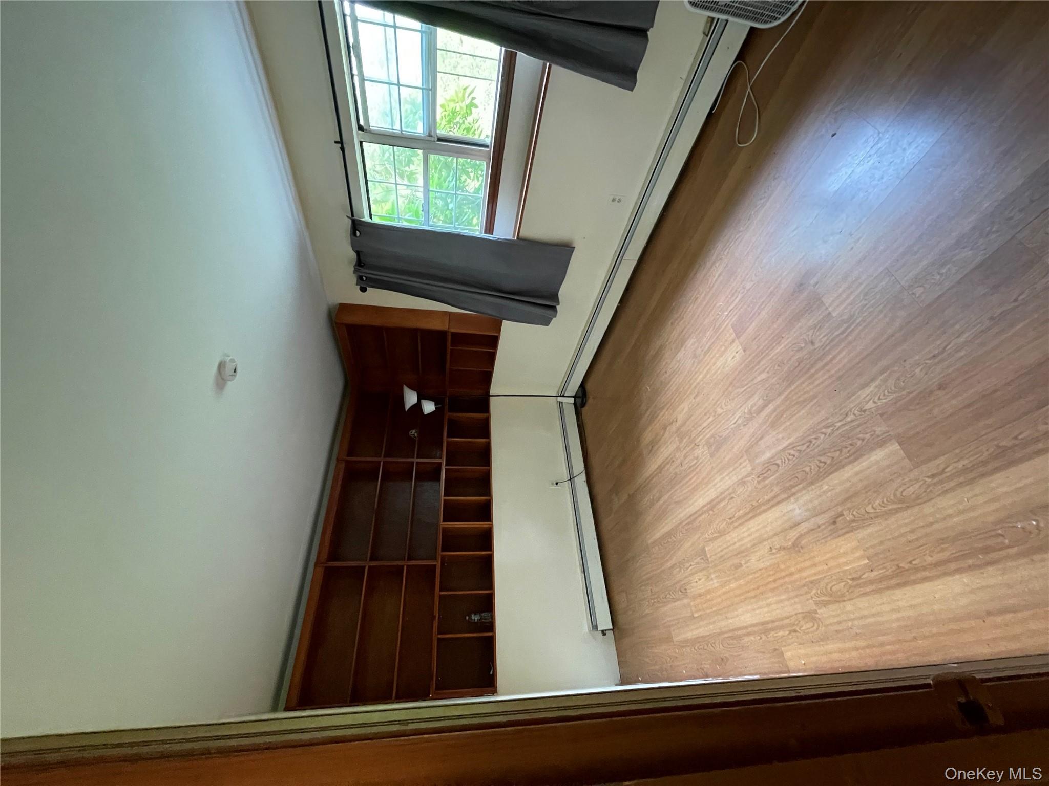 257 Lake Road Salisbury Mills, NY 12577 - Photo 14 of 30 an empty room with wooden floor and windows