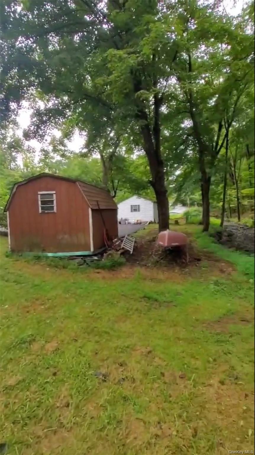 257 Lake Road Salisbury Mills, NY 12577 - Photo 19 of 30 a view of yard with swimming pool and trees