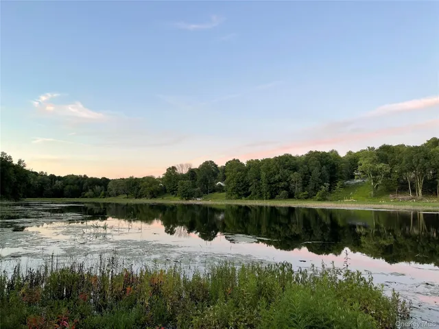 a view of lake with green space