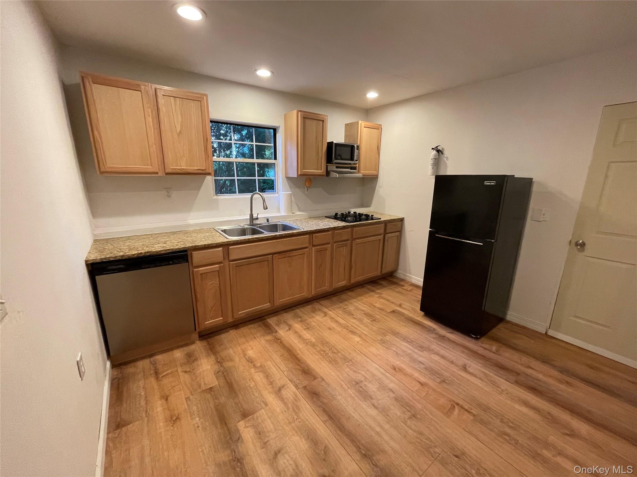 257 Lake Road Salisbury Mills, NY 12577 - Photo 23 of 30 a kitchen with stainless steel appliances granite countertop a refrigerator and a sink