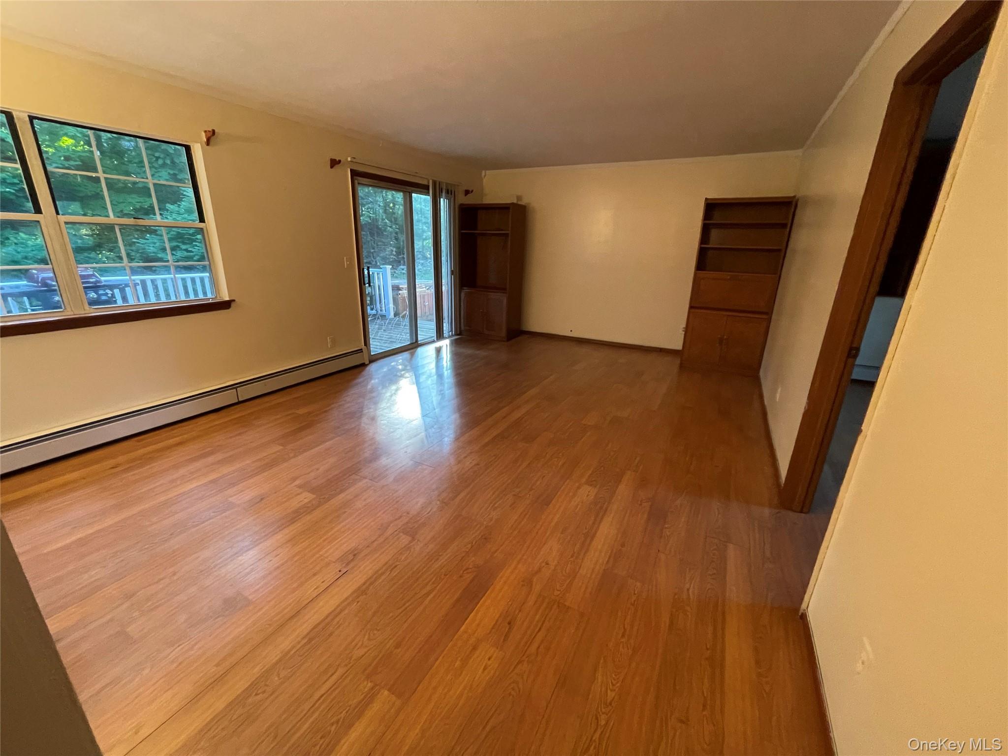 257 Lake Road Salisbury Mills, NY 12577 - Photo 24 of 30 a view of an empty room with wooden floor and a window