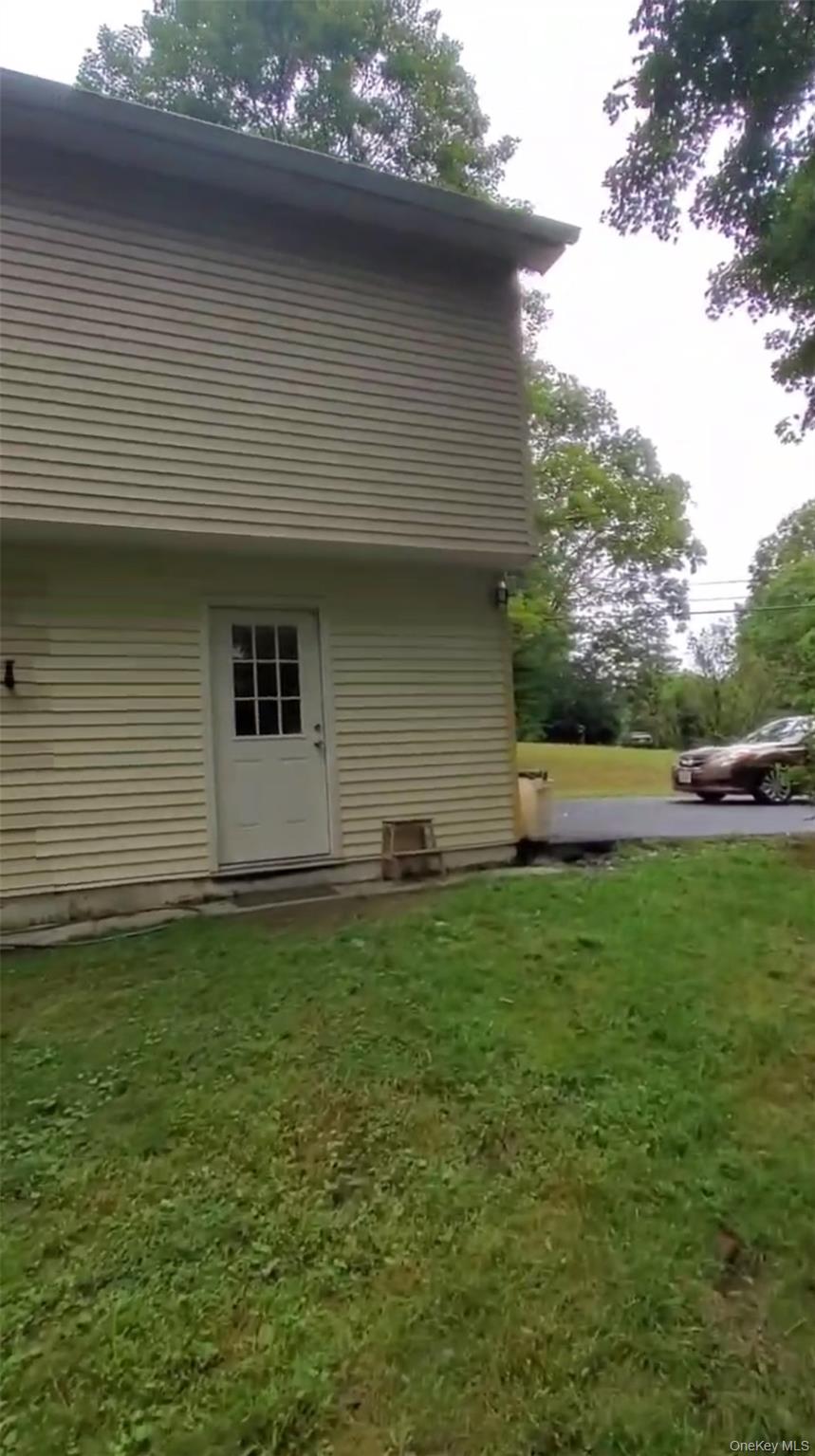 257 Lake Road Salisbury Mills, NY 12577 - Photo 29 of 30 a backyard of a house with lots of green space