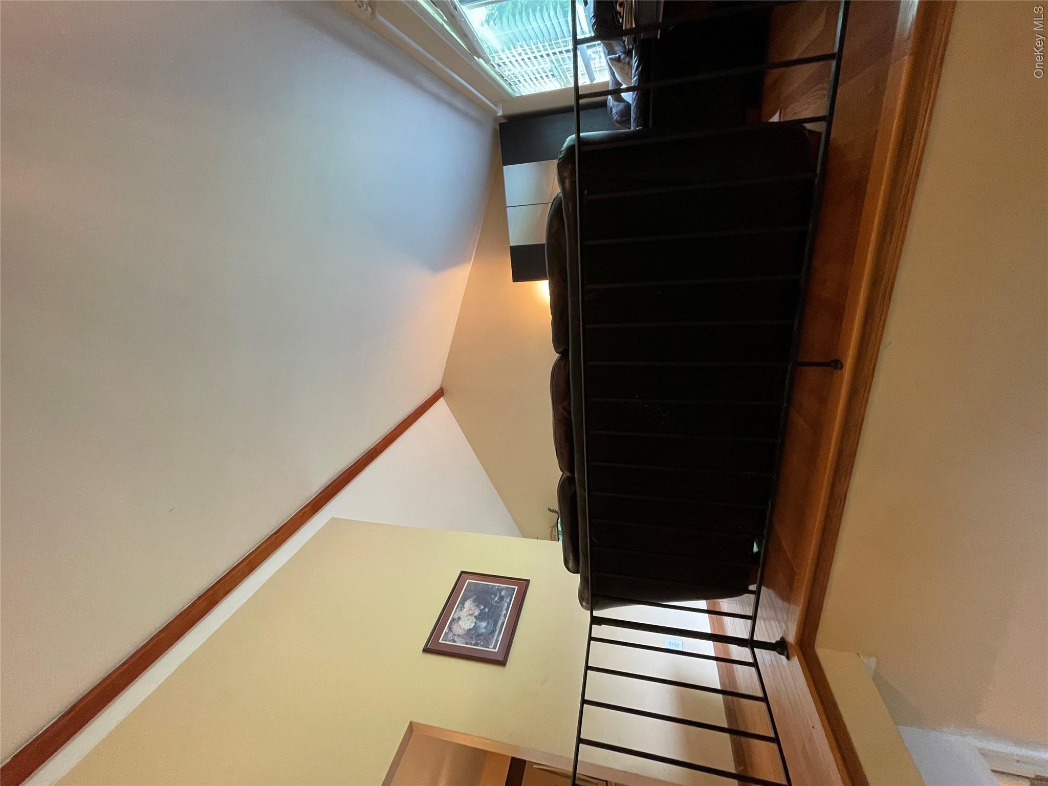 257 Lake Road Salisbury Mills, NY 12577 - Photo 7 of 30 Staircase with vaulted ceiling and wood finished floors