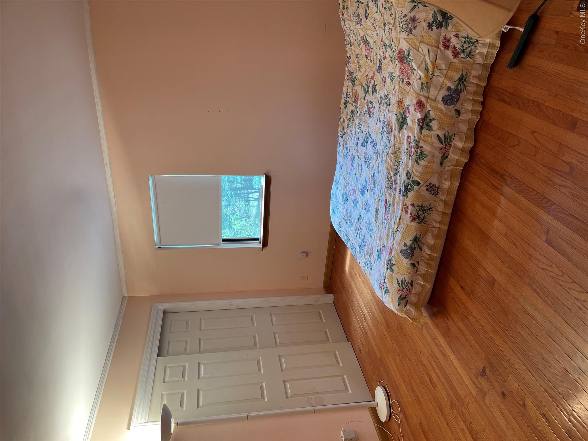 257 Lake Road Salisbury Mills, NY 12577 - Photo 9 of 30 Bedroom featuring crown molding, light wood-style floors, and a closet