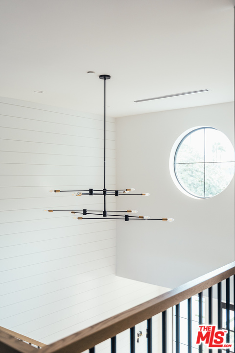 3207 Earlmar Drive Los Angeles, CA 90064 - Photo 41 of 51 a view of a room with rack on the wall