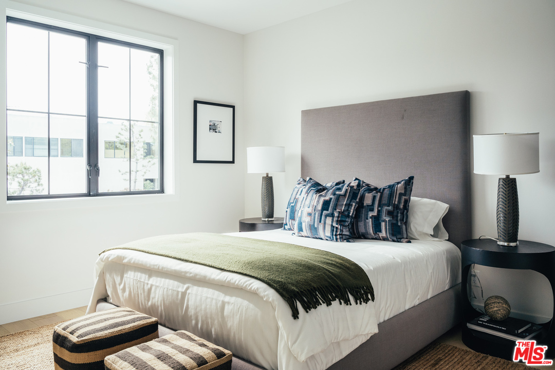 3207 Earlmar Drive Los Angeles, CA 90064 - Photo 42 of 51 a bedroom with bed and a large window