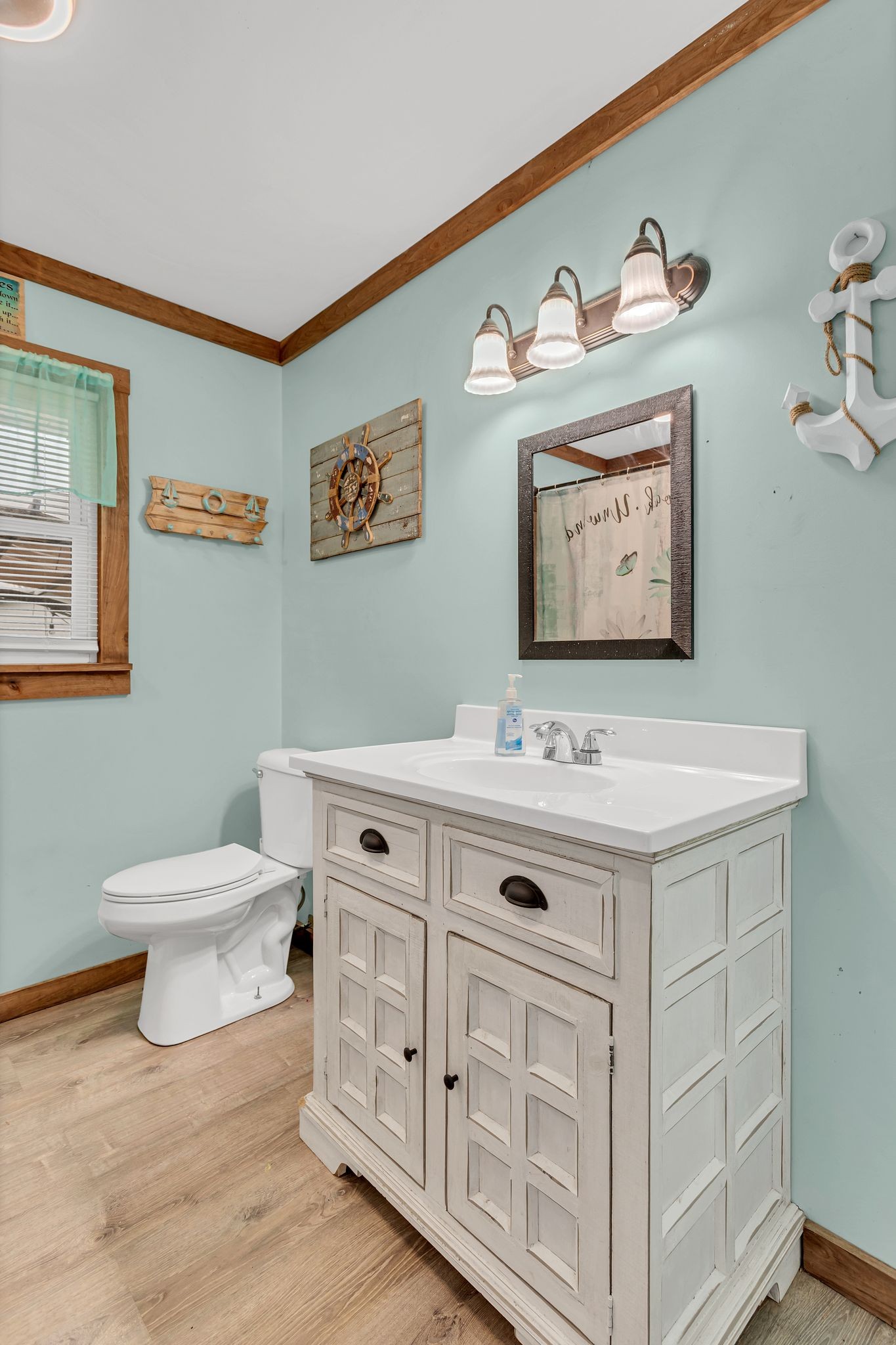 60 Main Street Ethridge, TN 38456 - Photo 11 of 25 a bathroom with a toilet a sink and a mirror