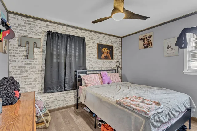 a bedroom with a bed and a couch