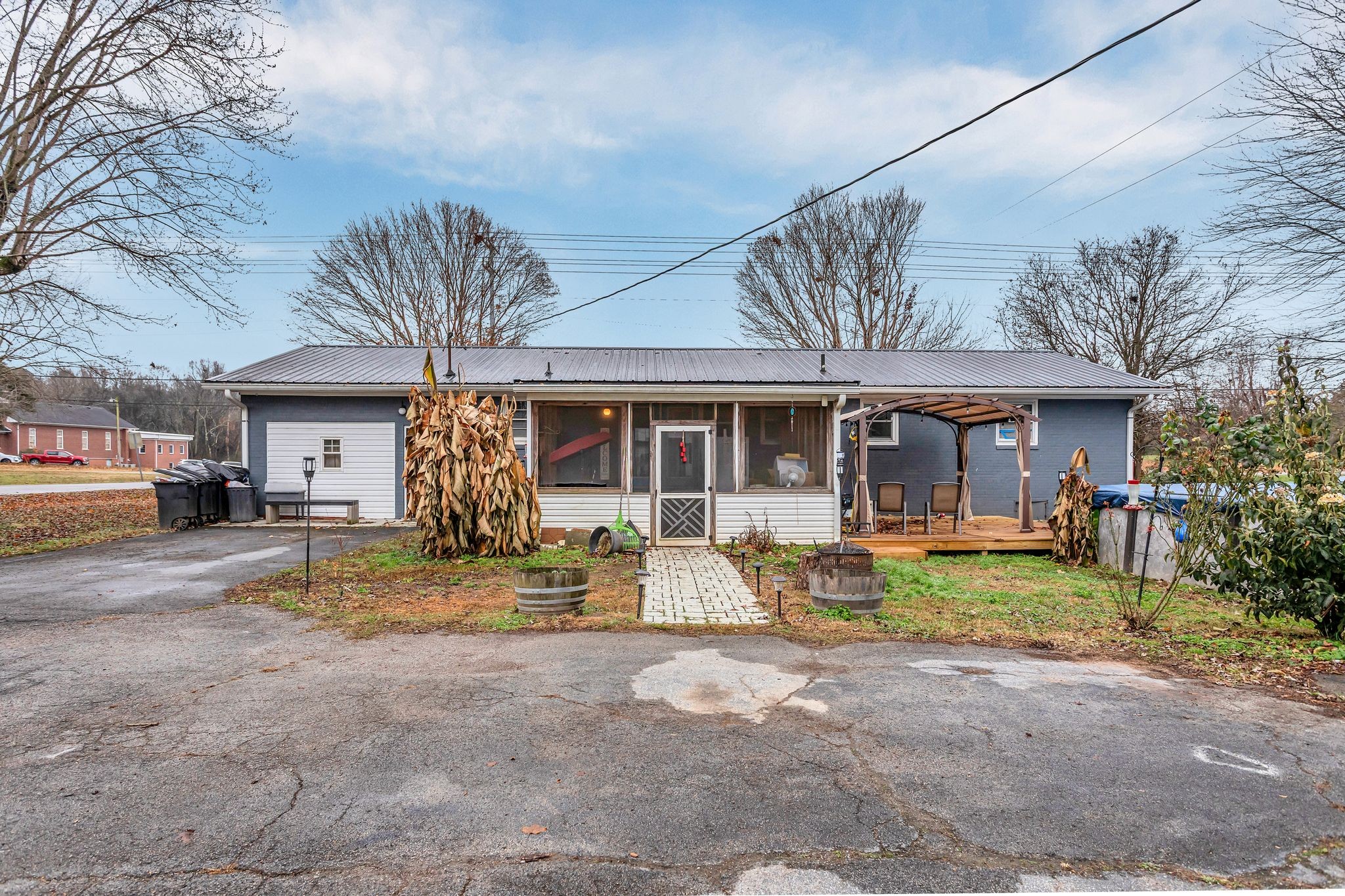 60 Main Street Ethridge, TN 38456 - Photo 20 of 25 a front view of a house with swimming pool and glass windows
