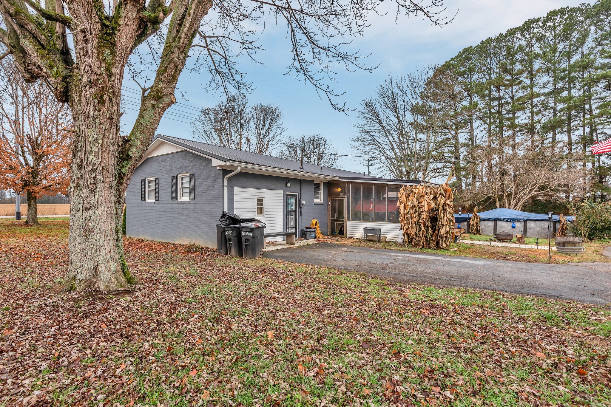 60 Main Street Ethridge, TN 38456 - Photo 21 of 25 a view of a house with a yard covered in snow