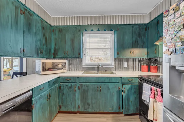 a kitchen with a sink and cabinets