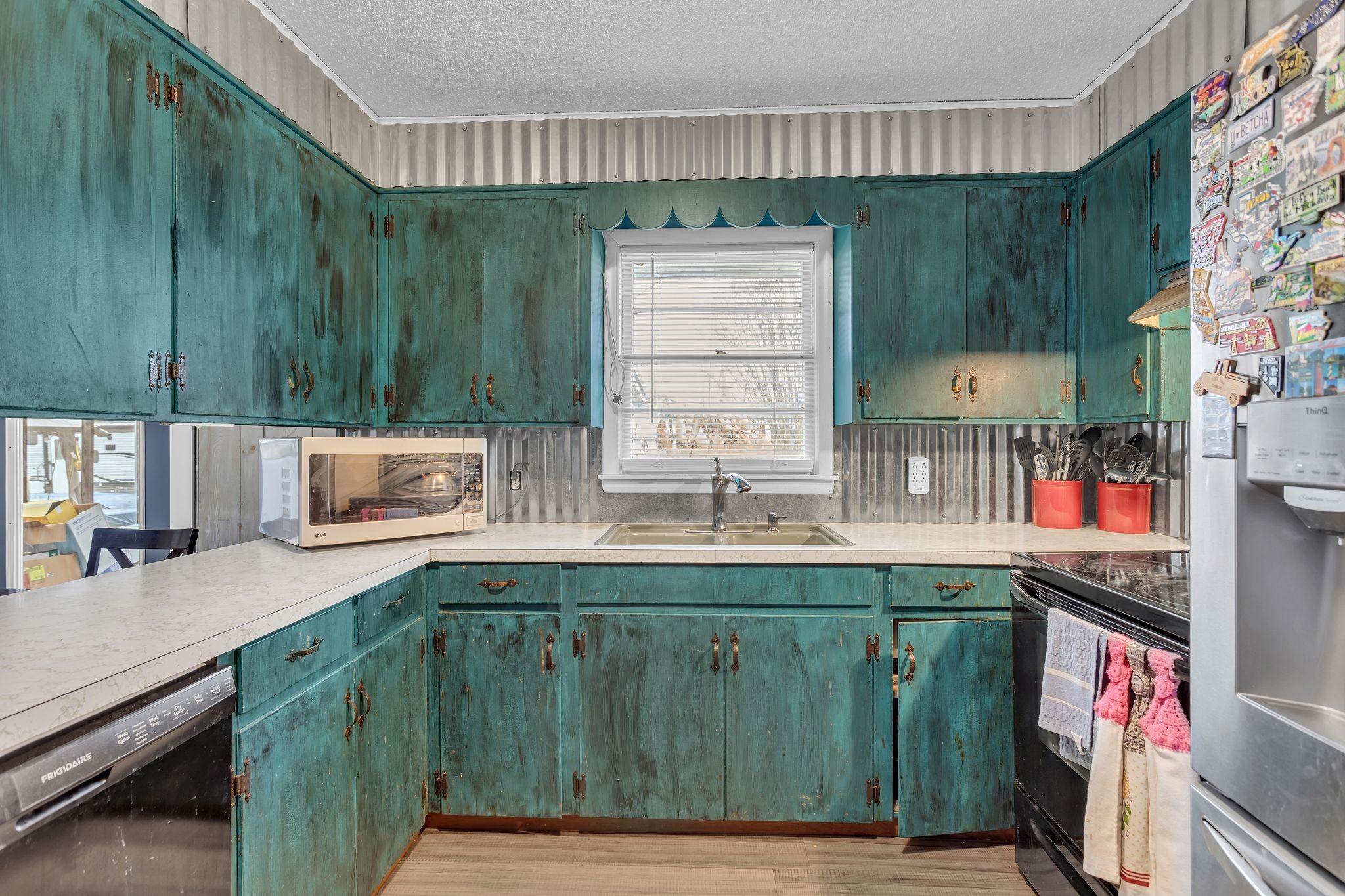 60 Main Street Ethridge, TN 38456 - Photo 7 of 25 a kitchen with a sink and cabinets