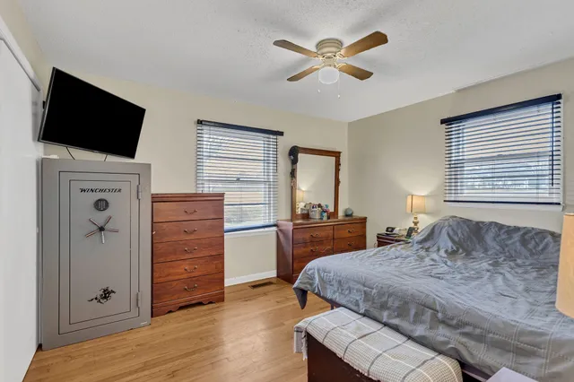 a bedroom with a bed and a television