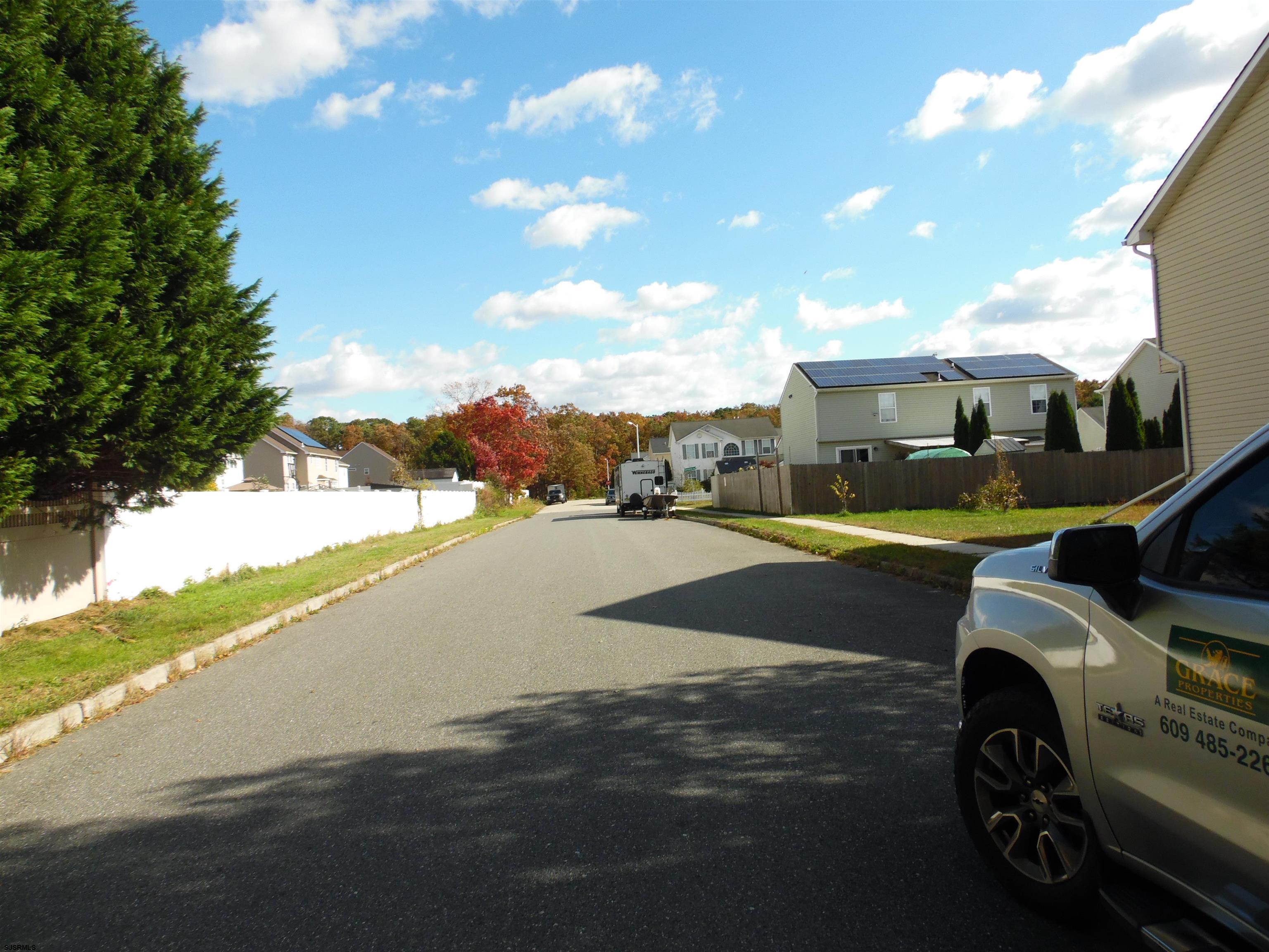 a view of a street with cars