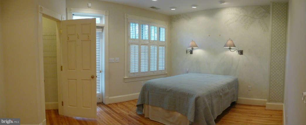 618 4th Street Northeast Washington, DC 20002 - Photo 16 of 30 a bedroom with a bed and a window