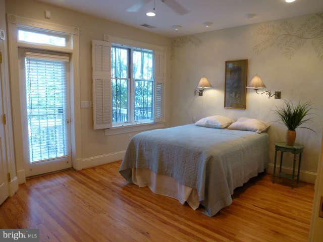 618 4th Street Northeast Washington, DC 20002 - Photo 17 of 30 a bedroom with a large bed and a window