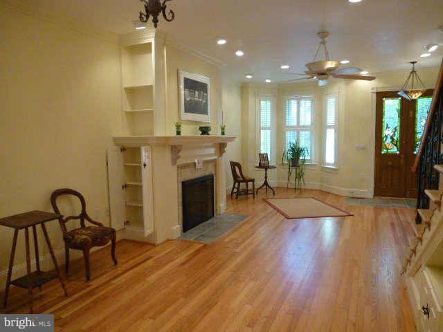 618 4th Street Northeast Washington, DC 20002 - Photo 3 of 30 a living room with furniture a fireplace and a flat screen tv