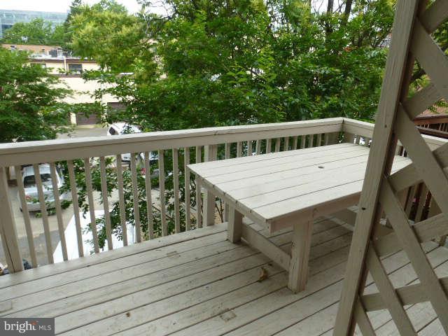 618 4th Street Northeast Washington, DC 20002 - Photo 21 of 30 a roof deck with wooden floor and fence