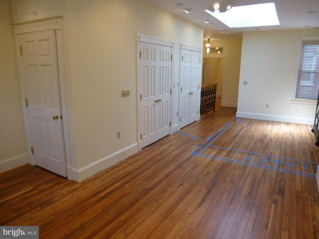 618 4th Street Northeast Washington, DC 20002 - Photo 22 of 30 a view of a hallway with wooden floor and closet area