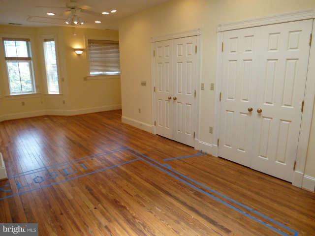 618 4th Street Northeast Washington, DC 20002 - Photo 23 of 30 an empty room with wooden floor and windows