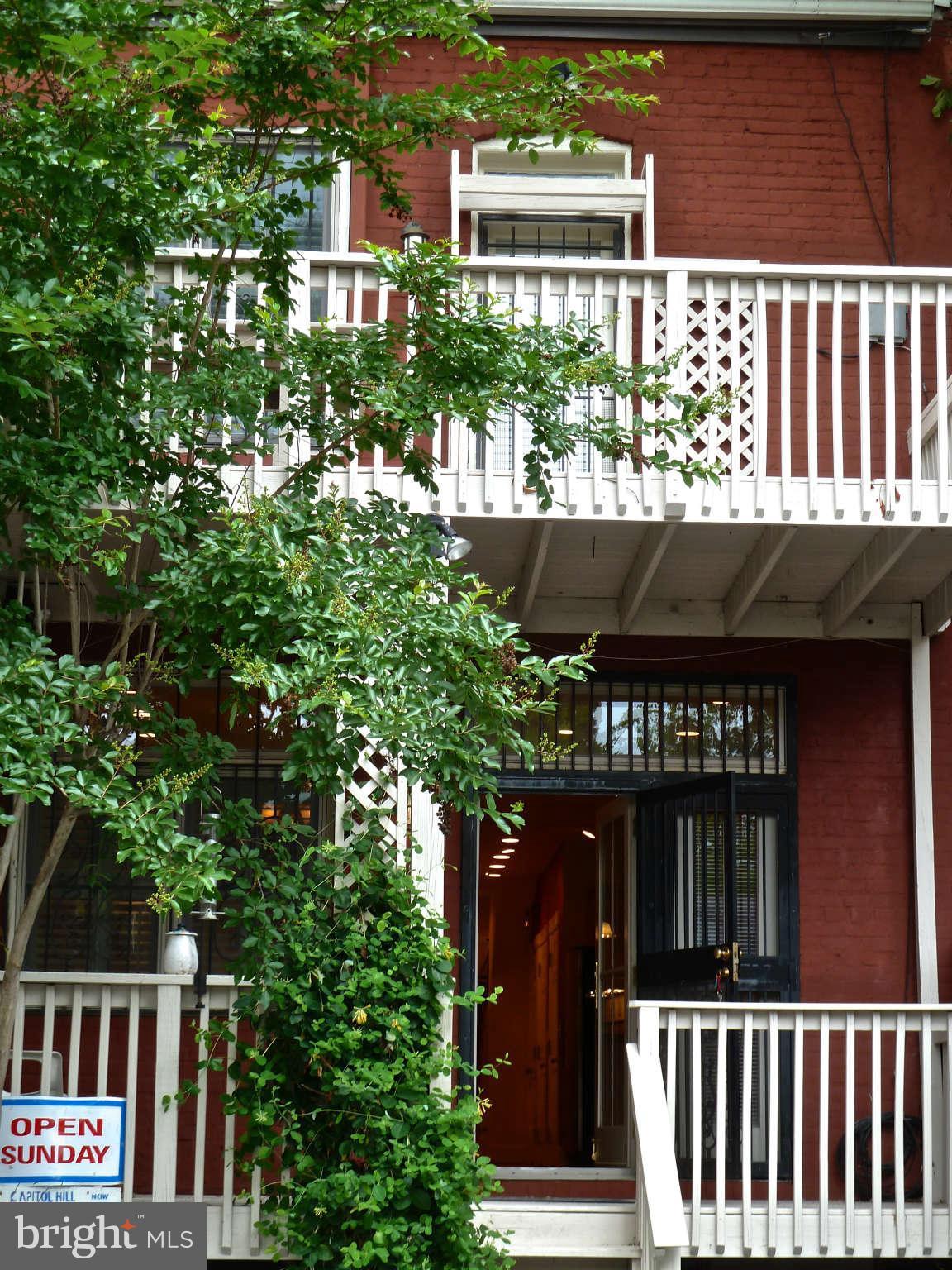618 4th Street Northeast Washington, DC 20002 - Photo 27 of 30 a front view of a house with a tree