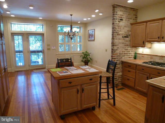 618 4th Street Northeast Washington, DC 20002 - Photo 8 of 30 a kitchen that has a table and chairs in it