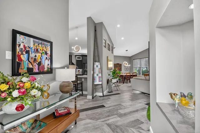 a kitchen with stainless steel appliances kitchen island granite countertop a sink and cabinets