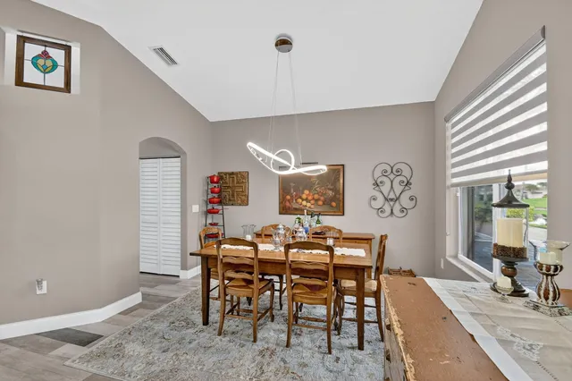 a living room with furniture and a bookshelf