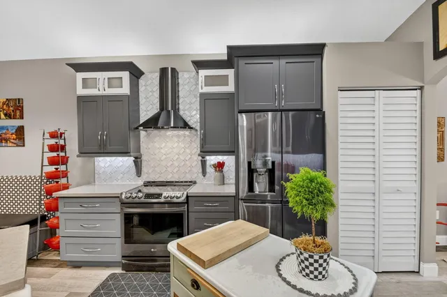 a bathroom with a double vanity sink toilet and a mirror