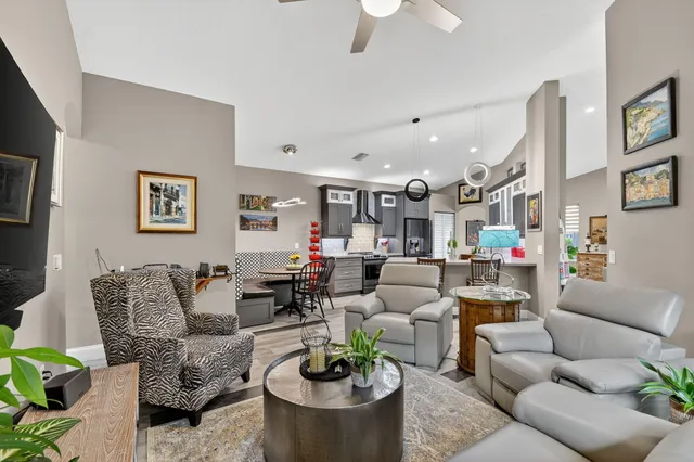 a view of a chair and tables in the balcony