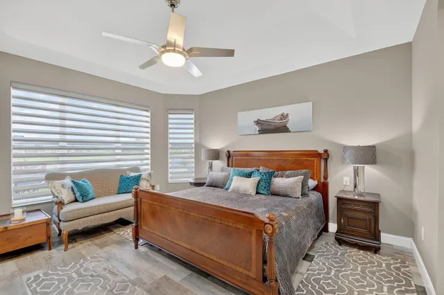 an aerial view of a house with a garden and lake view