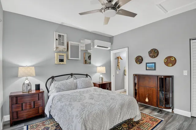 a view of a chairs and table in patio with a lake view