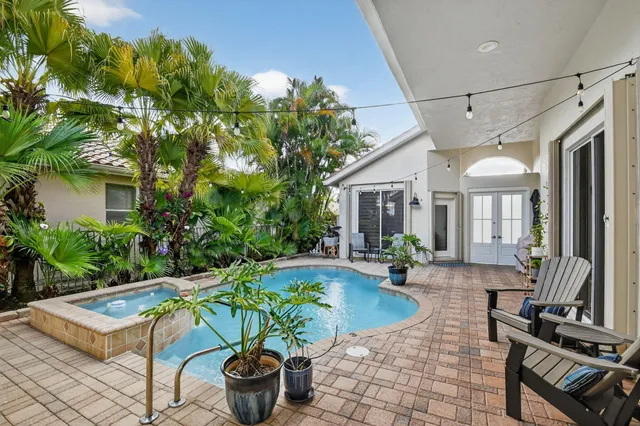 a view of a dining room with furniture and a window