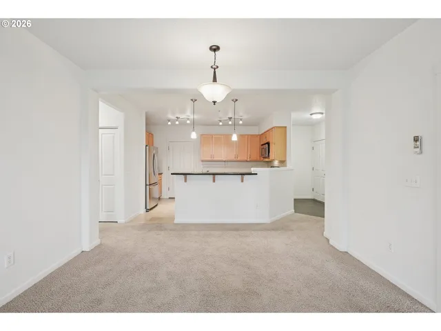 a view of a kitchen with a sink and dishwasher
