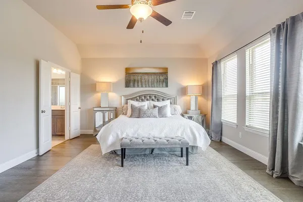 a bathroom with a glass shower door and mirror