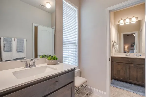 a kitchen that has a stove and a window