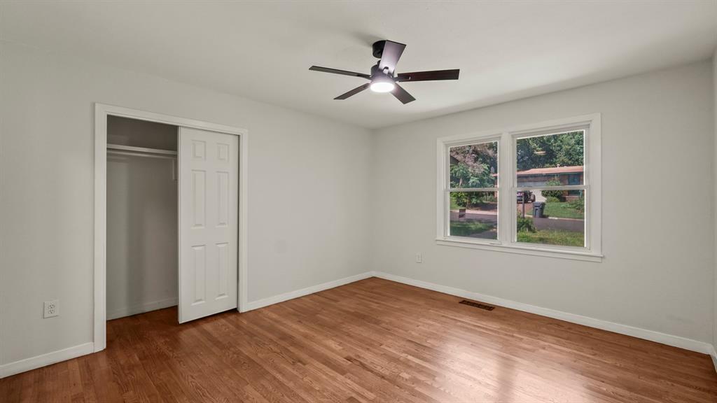 4600 Robinwood Drive Waco, TX 76708 - Photo 12 of 24 a view of empty room with wooden floor and fan